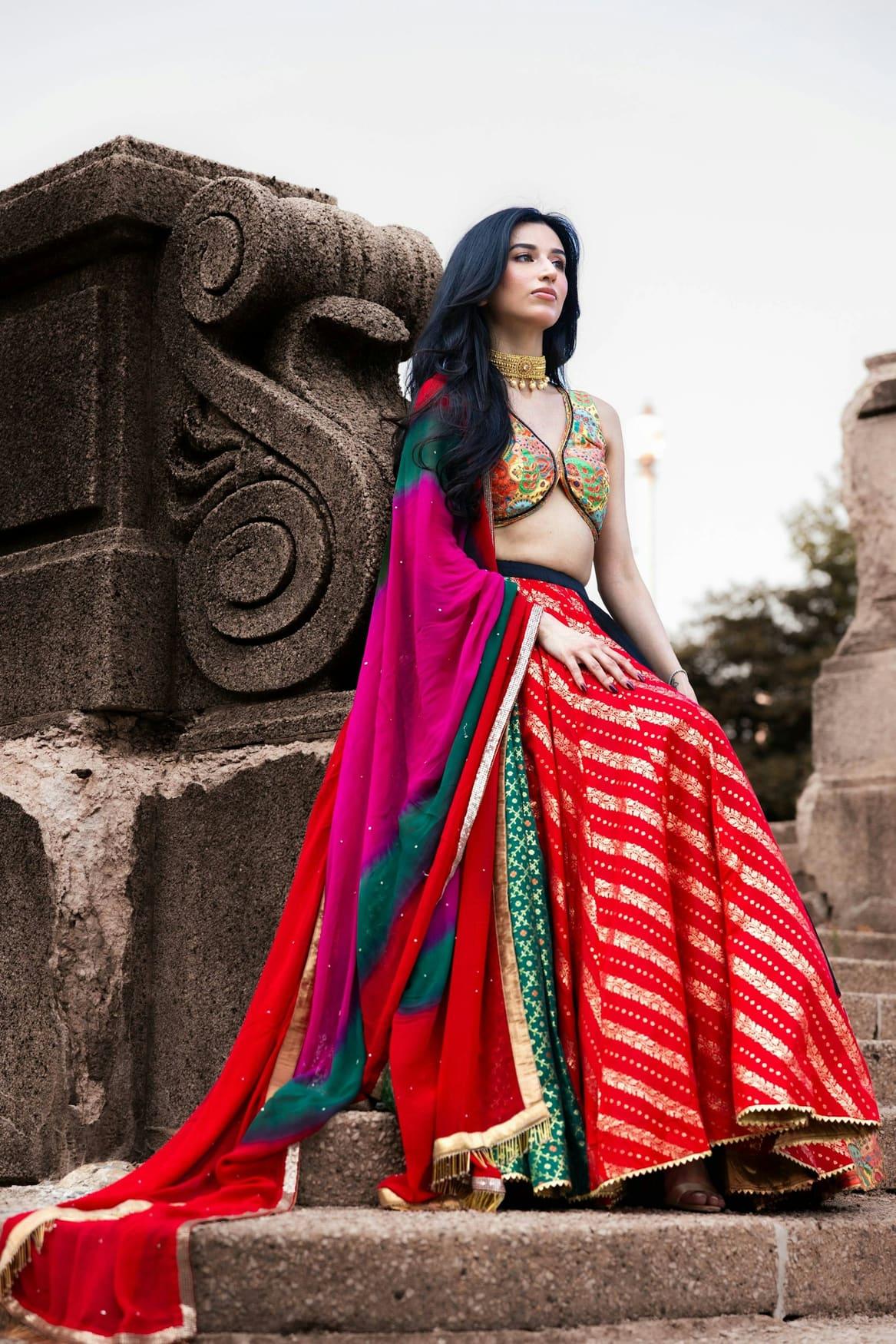 Woman in a red and pink striped leheriya chaniya choli